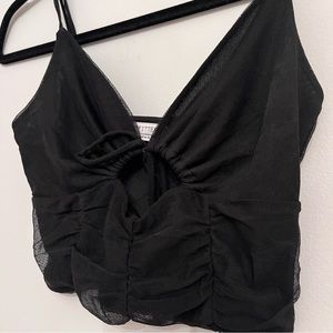 urban outfitters black party top with tie string in middle and adjustable straps